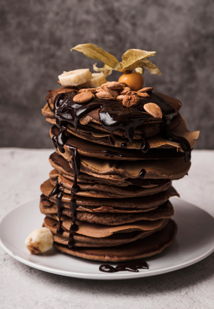 Chocolate pancake in a plate with chocolate syrup 